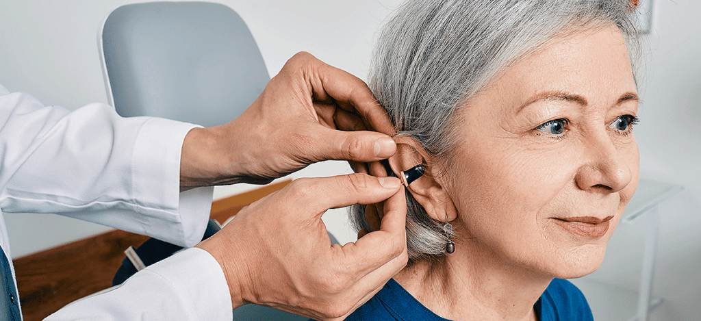 Woman getting fitted with hearing aids