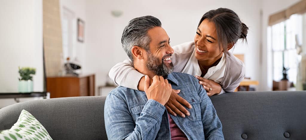 Mature couple overcoming their hearing loss and communication challenges with hearing services